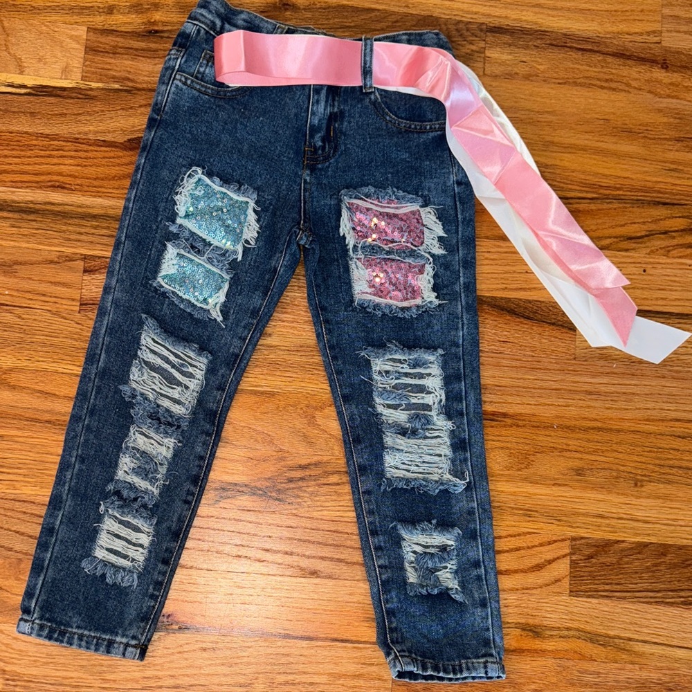 Distressed Denim Jeans with Pink and Blue Accents